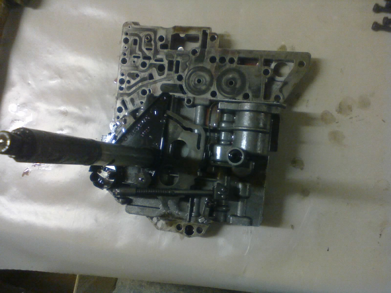 With some finagling, the valve body comes out, along with the manual (gear selector) shaft.
